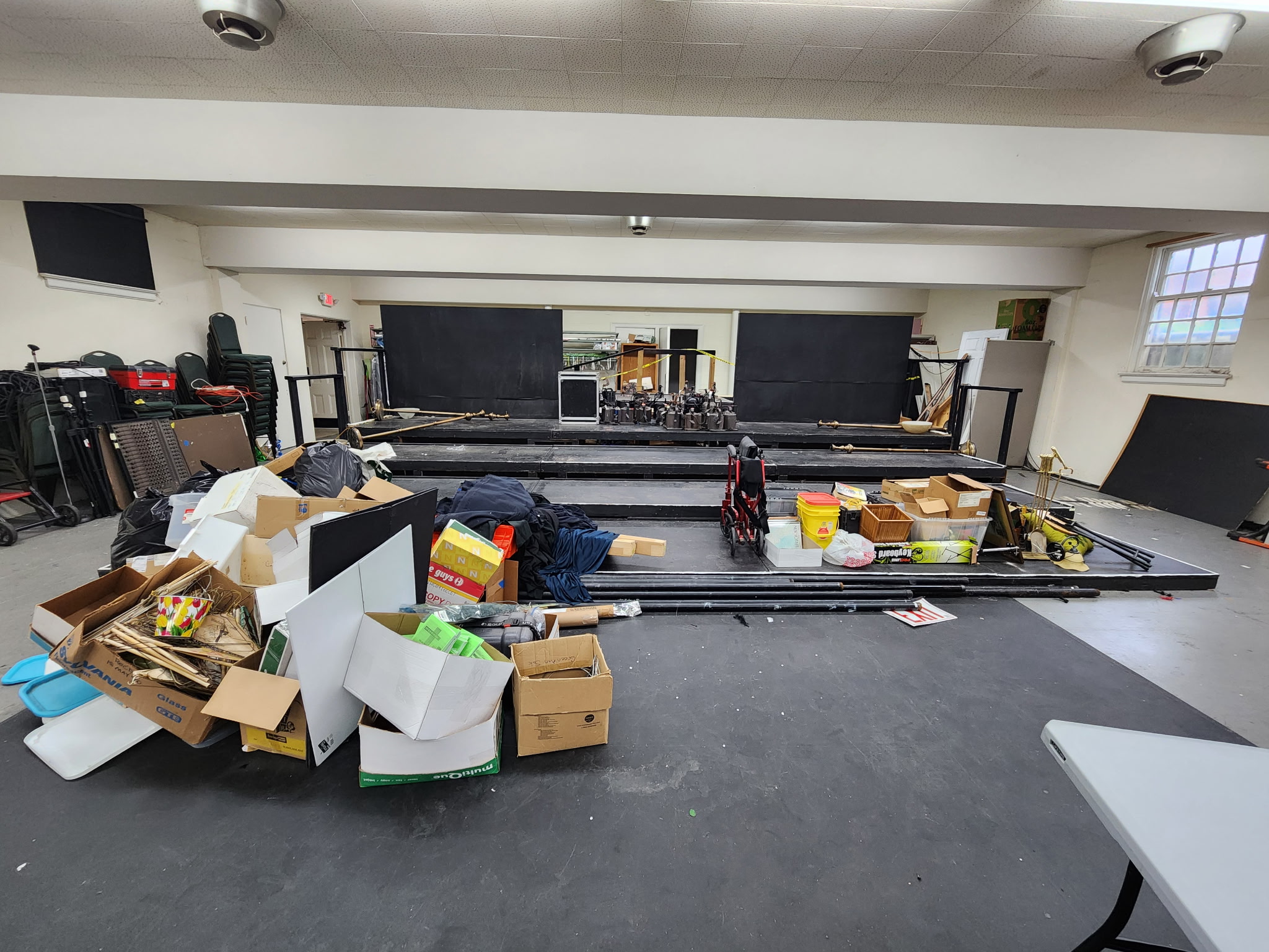 Warehouse cleanout in Chicagoland — before, boxes and debris piled across the floor